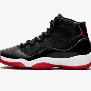 This is a Nike Air Jordan 11 Retro (GS) black/true red-white colorway Sz 7Y